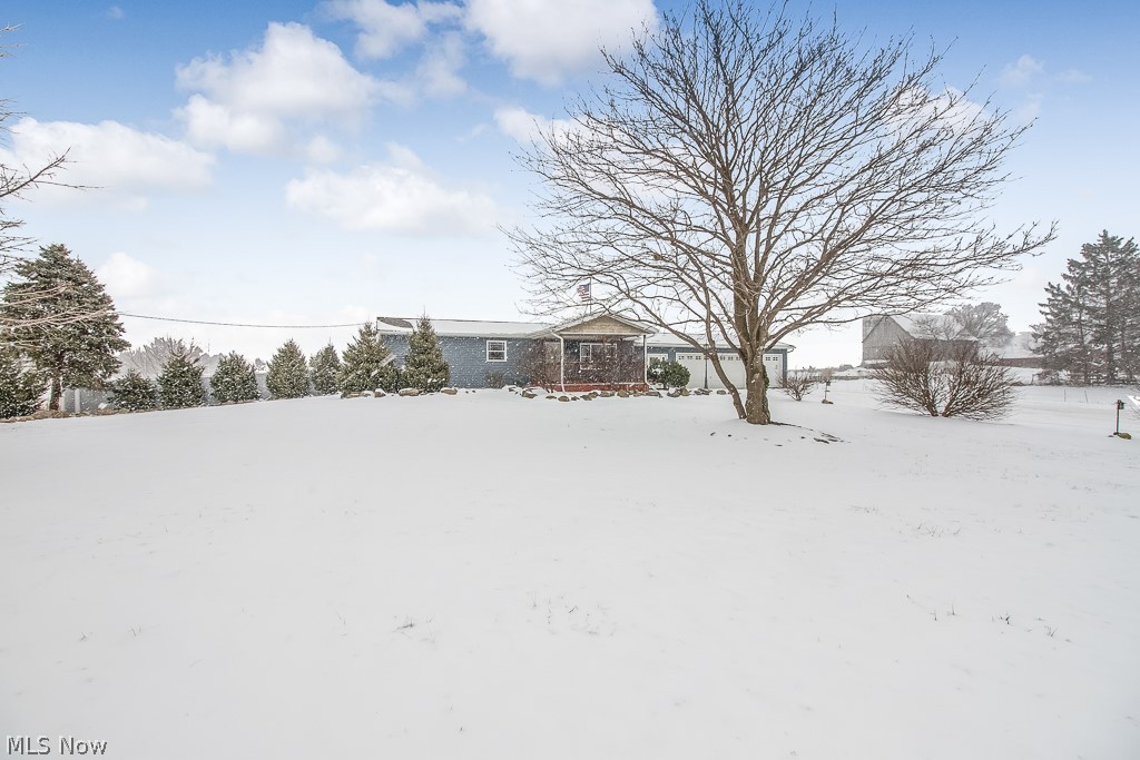 Must see this 3 bedroom, 2 full bath ranch with freshly painted main floor and new carpeting throughout! Enter the mud room with coat hooks and cabinets for storage, can be accessed from the front or the attached garage. Full bath right off mud room for easy clean up after working in the garage or the heated shop out back. Eat-in kitchen with stainless steel appliances that all stay, granite countertops, ceramic tile floor, stone accent wall and beautiful custom designed metal staircase that leads to the basement. Living room with gorgeous wood floor and large window for plenty of natural light. Three spacious bedrooms and another full bathroom finish off the main floor. The basement rec room is perfect for entertaining with a custom bar and pool table that stays! Basement also has laundry room with washer and dryer that stay and a storage room. Heated shop with office, 1/2 bath and storage room has 3 phase commercial power. Don't miss out, schedule your private showing today!