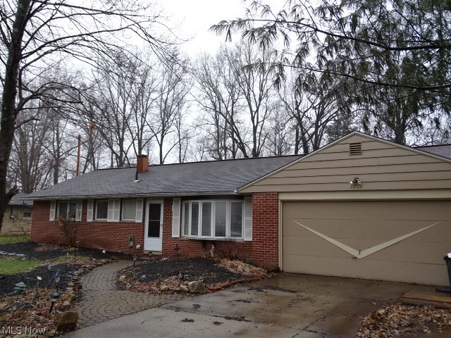 This expansive 2700 sq ft brick ranch with attached 2 car garage offers 4 bedrooms, 3 full baths, an office with built in shelving, living room/dining room combination, HUGE family room with brick fireplace, eating area and vaulted ceiling with sky lights and sliders to your private patio. 500 sq ft 4 season room with gas fireplace, vaulted ceiling and sliders out to your spacious private deck overlooking your half acre lot that backs to woods. Newer wood laminate flooring throughout. Owners started updates but needs you to finish and make it your own. Selling "As Is".