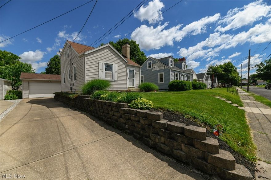 It's summertime and the market is HOT! This beautiful, well maintained bungalow is perfect for a starter home or for someone downsizing. Close to the Hall of Fame and easy access to Rt. 62 and I-77. This house is ready to move into. The kitchen was recently remodeled featuring a stainless steel refrigerator, stove and dishwasher. An above stove microwave and  a garbage disposal. Step out of the kitchen onto the wooden deck that overlooks the fenced in back yard. Going downstairs to the family room (A.K.A. Man Cave) and laundry room where you will see the water softner. There are two bedrooms (though one is being used as the dining room) on the main floor and an updated full bathroom. Upstairs is the third (master) bedroom and a half bath.