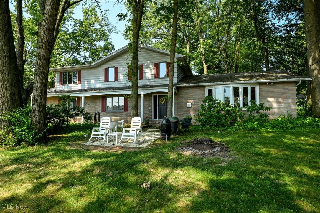 LAKEFRONT LIVING YEAR ROUND! Is your dream to live on the lake - to boat, swim and fish? Seize the moment and you can be enjoying lake living this year! In addition to a beach swim area, playground, tennis and pickleball courts, this active neighborhood features events like "Food Truck Fridays", multiple clubs and seasonal parties at the pavilion. The house is the perfect blend of lake and year-round home too. The living room has vaulted ceilings and large lake-facing windows and opens to the dining room as well. The front patio area provides a great vantage point and just across the street is YOUR BOAT SLIP. For those days when the weather is more subdued you have plenty of house still to enjoy. The Owner's suite is huge with vaulted ceilings and a door to the balcony. The bath features both a soaking tub and a standing shower, plus double sinks. There are two additional bedrooms and a full bath on this floor and on the lower level a fourth bedroom and bath situated for your guest's privacy. Additionally, the basement level has a rec room and office space, plus laundry. New Roof 2019 This home is sold as-is with seller to make no repairs. Green Local School District. Don't miss out on this amazing opportunity!