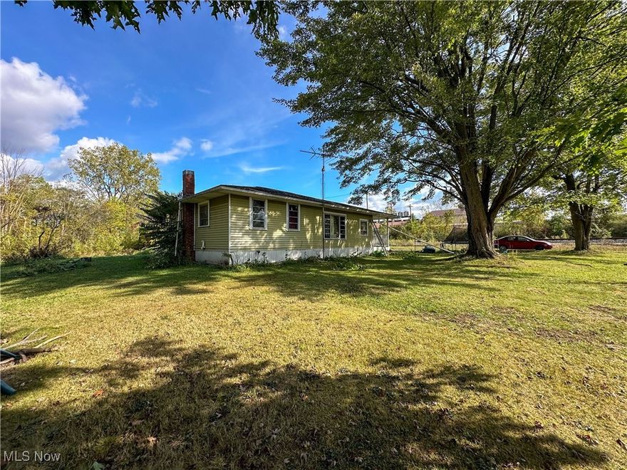 Ranch style home situated on a full acre of land! Tucked away and private, this home is suited for a small family or single resident. Talk about privacy!! Through the expansive front porch you will find an entry living room, into the family room. Down the hall sits 3 bedrooms. Enter the lovely sized kitchen with granite countertops and conveyable newer appliances next to a full bath. A breezeway leading to the one car attached garage and a full basement complete this home. A ton of trees way in the back of the property provides seclusion and entertainment galore. There is a separate building situated on the property- previous owner used it as a "man cave" but could also be a she shed, home office or extra storage! Don't miss this one before it's gone.