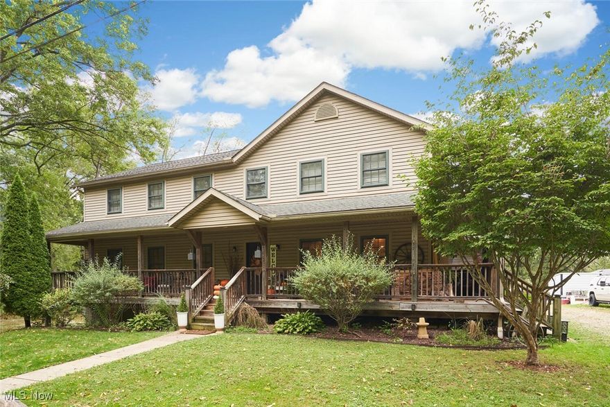 This beautiful country home features a spacious front porch and serene surroundings. The main house boasts an open floor plan with a large kitchen, 8-foot island, and custom finishes, plus a cozy living room, main-floor laundry, and two mudrooms. Upstairs, enjoy a large master suite with a bath and walk-in closets, along with three additional bedrooms and a full bath.

The finished walk-out basement is ideal for guests, featuring a full in-law suite with a bedroom area, laundry, workout room, kitchen, and a full bath.

Outside, relax in a fenced yard with a lovely patio leading to a 960 sq ft guest house, complete with a front porch, modern kitchen, two bedrooms, an office, and a full bath.

Updates include new tile flooring in house (2024) and refreshed bathrooms (2024), updated laundry (2024), fresh paint throughout (2024), a new hot water tank (2021), and new central air (2022). Set on nearly an acre on a quiet dead-end road, this property blends tranquility and convenience, just minutes from city amenities. Don't miss this unique opportunity!