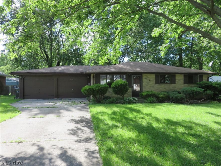 Solid brick ranch with attached 2-car garage, situated on a lovely treed yard.  The lot is extra-wide and has a privacy fence.  With a little bit of work you can make this your dream home.  Sold as is.  CASH only.