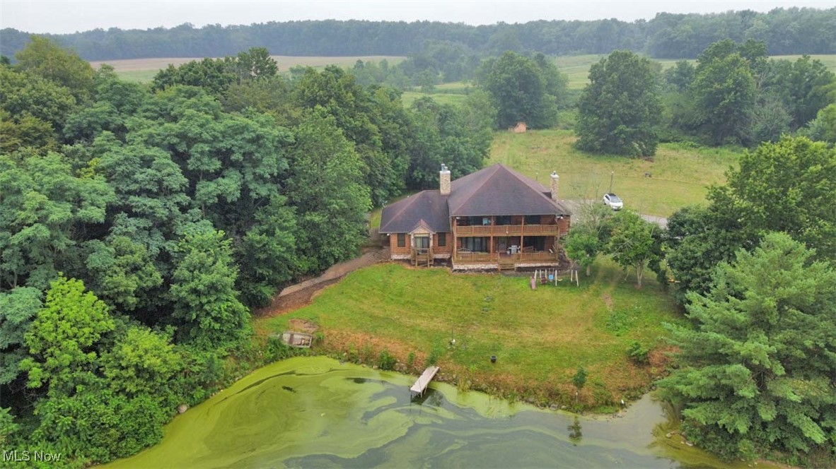 Hideaway Auction Opportunity, Auction #1: 3,800 Sq. Ft. Log Home on 10.8 Acres with Two Lakes, Four Bedrooms, Five Bathrooms, Two-Car Garage, Secluded, Free Gas. Auction #2: Ranch-Style, Log-Sided Home, Three Bedrooms, Former Commercial Office Warehouse, Large Blacktop Parking/Turnaround, 11 Acres, Zoned Commercial. Washington Twp., Stark Co., Marlington Schools. Live Onsite with Online Bidding Available on Real Estate. All sells on location. ONLINE BIDDING BEGINS FRIDAY, AUGUST 29, 2025, at 12:00 PM, and AUCTION LIVE ON-SITE BIDDING WILL BEGIN THURSDAY, SEPTEMBER 4, 2025, at 5:30 PM, REAL ESTATE SELLS AT 6:00 PM. Auction #1: 6378 Union Ave. NE, Alliance, OH 44601. Built in 2002, gorgeous log-sided home features oversized two-car attached garage, mudroom entry, large chef-style applianced kitchen, granite countertops, built-in brick pizza oven, butler’s pantry with dishwasher and double sink, formal dining room with cathedral beam ceiling and skylights. Great room/living room with stone mantle, gas fireplace, high-top wet bar, main-level master bedroom with master bath, garden tub, walk-in closet, and laundry. Kitchen, great room, and master all have access to a full-length porch overlooking the lake. Heavy log open staircase leads up to 3 bedrooms, each with a shower bath, walk-in closets, and access to a covered second-level deck, laundry/utility room also up. Finished partial basement with small swimming pool, bathroom, and large walkout to the lake. Two-pole buildings used for storage. 10+ acres. Secluded hideaway setting. Free gas from a well, private well, and septic. Shown by appointment only. The properties will be open on auction day, starting at 2:00 PM. Call the auctioneer with questions. See MLS #5148872 for Auction #2: 6428 Union Ave. NE, Alliance, OH. 44601