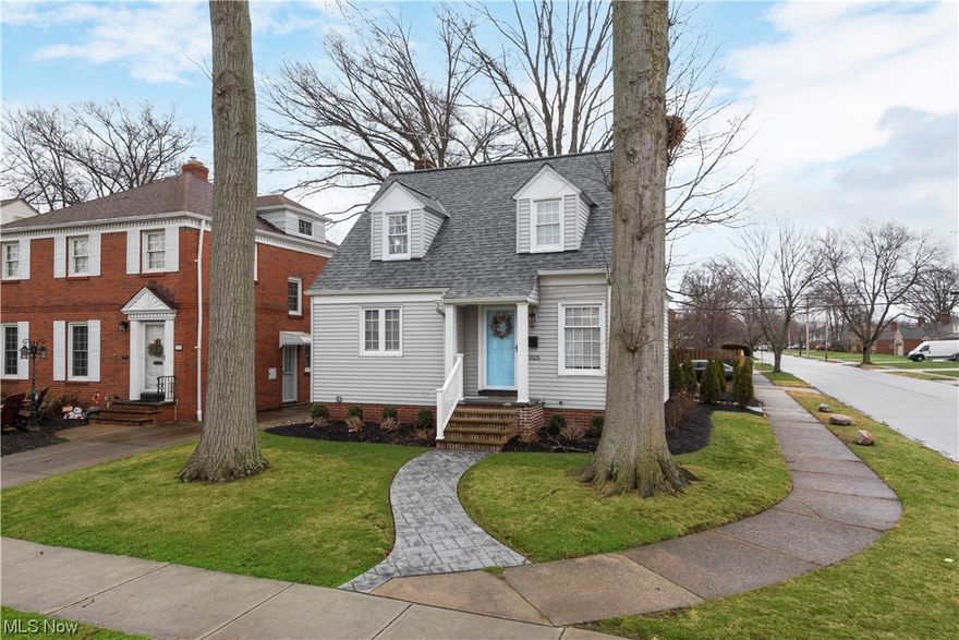 Wonderful curb appeal and charm abounds in this Cape Cod / Bungalow style home in prime West Park location. Nicely landscaped yard with two car detached garage. Stamped concrete front walkway leads to rebuilt covered front porch. Cute rear yard with with landscaped island, arborvitaes, and gated entry to rear yard provides privacy for the stamped concrete patio. Home interior has been lovingly updated with modern touches and colors. Hardwood floors refinished throughout home except for stairs and landing to second floor (carpet). Quintessential architectural lines and features with leaded glass built in, crown molding. rounded archways, custom built-in shelving on first floor. Living room has decorative fireplace providing a great focal point. Formal dining area with crown molding and built-ins. Kitchen has been updated. Stainless steel appliances. Tile backsplash and quartz counter tops, new cabinets and pulls and wood flooring. Movable island does not stay. First floor bathroom remodeled with luxury soaking  tub, marble flooring and tub surround. Stunning feel to pamper yourself. Adjacent to bathroom is a first floor bedroom. Upstairs features two large bedrooms with walk in closets. Hardwood flooring and dormered windows provide great space to relax at the end of the day. Full basement with large laundry area with cabinets and oversized counter area. Basement offers ample space and footprint to partially finish adding living space. White California blinds on all windows. See feature and update sheet for full details. Significant updates are: water proofing, rebuilt front & rear porches, HVAC, kitchen, bathroom, interior painting, refinished hardwood flooring, all new lighting, appliances, electrical, home entry doors, rear patio and more. Fantastic neighborhood close to shopping, freeways, and Kamms Corner amenities.