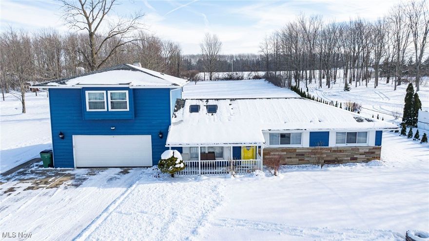 Situated on a 1.09 acre lot with deep setback off Lester Drive; a dead-end street. Very well maintained home with several updates and tastefully decorated ... neat, clean and orderly. Great first impression as front door enters into a living room with vaulted and wood beamed ceiling, ceiling fan, two skylights and simulated stone-faced, electric fireplace. Living room is open to the dinette area with a pass through to the spacious kitchen. Four season room in rear completely restored and insulated with metal roof and vinyl siding ... eight new windows (abundant natural light), new door to exterior, new mini-split heating & cooling unit; a bright and tastefully finished room with laundry provisions! The remainder of the main level includes three bedrooms, one and one half bathrooms and a drop zone transition to & from the attached garage. The upper level is a huge, carpeted family room with a nifty window seat, newer vinyl windows, two ceiling fans, two large closets, built-in entertainment center and a brick faced, wood burning fireplace!

Larger than average, attached garage with newer overhead door, automatic opener with key pad and stamped concrete floor. Covered front entry/porch, newer front door and storm door. Dimensional shingle roofing, stone accent on front elevation and wide overhangs. Paver stone patio with pergola and two storage sheds in rear (per county record, 20 x 10' & 12 x 8'). 86 Arborvitaes planted on the southern boundary line! Long, cement driveway with turnaround area and a section that wraps around the garage ... ample parking!

Well water service was recently sampled by the Lake County General Health District. Unique sanitary sewer plant at north end services housing on Lester Drive; a Lake County Department of Utilities facility with quarterly billing. Enbridge Natural Gas service is available at the roadway.