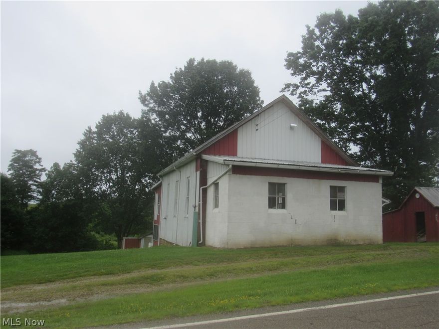 Hunting cabin sitting at the edge of over 60,000 acres of hunting/fishing area. ( AEP Wildlife area ) Covering Muskingum,Morgan, and Noble counties. 2 large open rooms for tables and beds.  Large wood burner for heat. Range , refrigerator ,and Microwave stay. No running water but plenty of rain barrels and outhouse!!