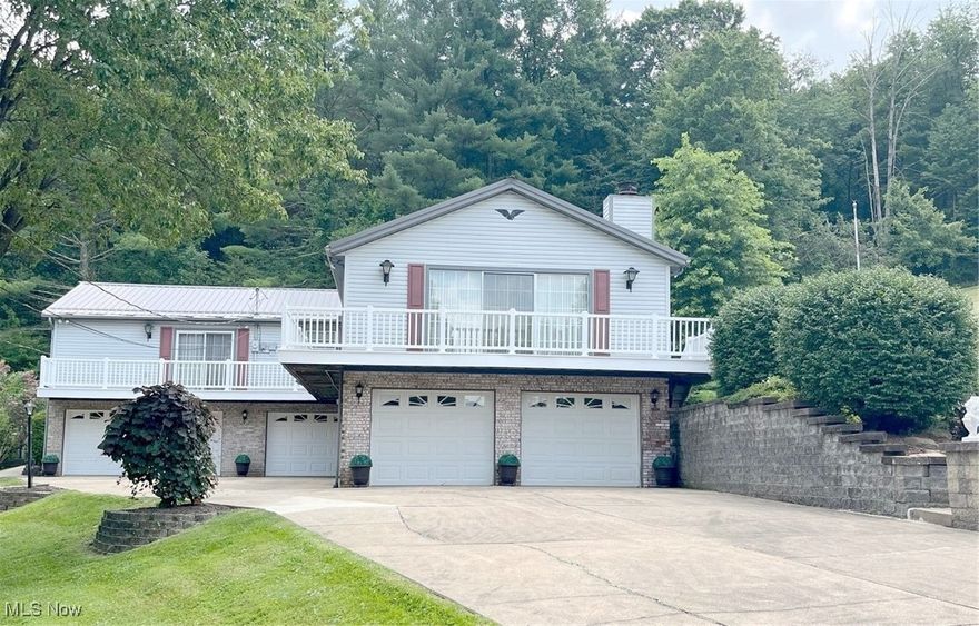 Welcome to 411 E. Mohawk Dr., Malvern. Nestled in the private community of Lake Mohawk. Beautifully updated with modern touches, this home is much larger than it looks, and the added bonus is a five- car garage.  Move in ready!
Walk through the door to a perfect oasis boasting one floor living with spacious rooms and hallways. Main floor hosts a stunning kitchen with plenty of wood cabinetry and granite counters.  Separate dining area for those large family gatherings and an outdoor covered space to enjoy the park-like setting in the private backyard. Also included are four bedrooms, three full baths, living room with gas fireplace and an abundance of storage. Most of the rooms have sliding glass doors to the deck or patio. Family room has views of the picturesque backyard and accesses the outdoor covered patio. Take a stroll through the manicured walkways or stop at the pool for a quick dip to cool off. Lower level has private office which leads to garage space and access to utilities. This package includes a 10' x 12' shed and home features a whole house generator system for additional peace of mind. Now is the time to enjoy lake living in this nicely updated home. Lake Mohawk is a private, gated community with tennis courts, pickleball, baseball field, clubhouse and 500 acres lake for boating (unlimited horsepower), swimming and fishing. Separate membership for the golf course. Convenient to Akron, Cleveland and Pittsburg areas.