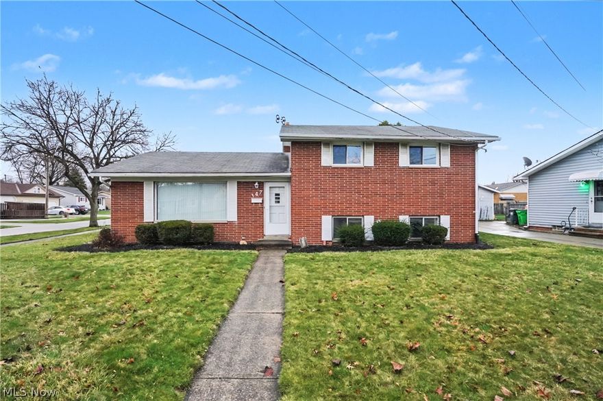 This well-built all-brick split-level home, constructed in 1963, delivers 1,928 square feet of comfortable, flexible living space on a generous 0.20-acre corner lot in the desirable, established neighborhood of Berea. Just minutes from Baldwin Wallace University, parks, shopping, and quick access to Cleveland and the airport, this 3-bedroom, 2 full bathroom home offers timeless charm and solid bones with room to make it your own.
Curb appeal that lasts: The classic all-brick exterior is low-maintenance and built to last. A paved driveway leads to the 2-car garage with plenty of storage space—perfect for tools, seasonal items, or a workshop. Mature landscaping and a peaceful street setting complete the welcoming first impression. Inside, smart split-level living: The layout flows beautifully with a walk-out lower level featuring a family room with built-in bar area—ideal for entertaining or relaxing. Upstairs you’ll find three bedrooms, all with beautiful original hardwood floors and two full bathrooms. The eat-in kitchen includes convenient built-in shelving, and large picture windows flood the home with natural light. Central air keeps everything comfortable year-round, and there’s loads of additional storage throughout. Out back, a spacious patio off the house is perfect for outdoor dining and entertaining, enhanced by a wooden privacy partial fence that offers excellent seclusion and privacy. The walk-out lower level provides tons of potential for your personal touch. Best of all, the home is move-in ready and retains classic mid-century details that you can update or preserve to suit your style. Whether you’re a first-time buyer, growing family, or investor looking for a solid property in a convenient location, 347 Beeler Drive checks every box for value, space, and location. Priced to sell in today’s market, with room to make it yours over time—this one won’t stay available long! Schedule your private showing today and imagine the possibilities.