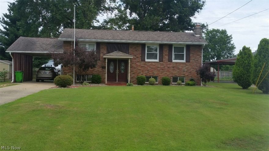 Spacious split entry home. All brick, carport, large fenced yard, finished basement. Home consists of living room, eat in kitchen, 2 bedrooms all on main floor. Lower level is finished with family room with fireplace, extra large utility room with walk out door, 2 additional bedrooms and full bath. Large patio area with patterned concrete and covered back deck. Large 12X16 storage building. Hardwood floors on main floor, tile in kitchen and baths, carpet in lower level. Privacy fence, hot tub, play center. Kitchen with white cabinets, pantry, all appliances stay.