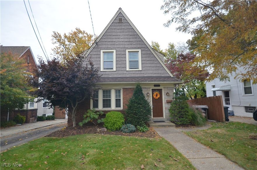 Spacious Goodyear Heights home -originally a 3 bedroom home- converted to a 2 bedroom with massive master suite featuring multiple closets! You will love the 2 car garage (1 car overhead door plus a man door and tons of storage space) w brick driveway and turn around area along with a private back yard including a patio and pond! Gorgeous brick and vinyl exterior leads to the living rm w fireplace (currently decorative, but gas line is stubbed in the basement, below) and access to the dining room w updated light fixture and wonderful daylight. The kitchen offers a beautiful mosaic backsplash. pantry storage, eating area and the microwave, range, dishwasher and stainless steel refrigerator all stay! The turned staircase leads upstairs to the very large master beroom, a spacious 2nd bedroom w 2 closets and a full bath w original claw-foot tub featuring a wrap around curtain and shower complimented by a nice vanity, Wainscoting, updated flooring and a linen closet. The full basement includes a nicely finished office with cabinets, built-ins and Naturestone flooring that continues to the full bathroom in the basement w shower & pedestal sink. Unfinished storage space includes built in shelving and the washer / dryer stay. Updates include: '24 Garage Roof (As of Oct 2024 on the schedule to be replaced). '22 Garage, Hot Water Tank. '16 Upstairs bath Drains/Pipes all the way to basement, commode, vanity, medicine cabinet. '03 Vinyl Windows. Home is well kept and ready to move in. Roof and furnace are functioning fine- installed in early 2000's and age of the roof and furnace were factored into the pricing. A/C does not work.
