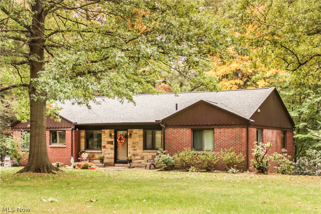 Welcome to 520 Dickemery Rd in beautiful West Akron Ohio. This charming 4 bedroom, two and a half bath homes features over 2000 sq ft of living space including a finished walk out basement. You will enjoy original hardwood floor throughout this home and the beautiful wooded views it has to offer. Updates include a remodeled half bath. Updated roof, new flooring in the kitchen and family room. The windows have been updated as well. A large sunroom offers amazing views of the wooded backyard. The 3 car attached garage is located under the home with access to the finished basement. This home features two fireplaces, a large family room in the lower level as well as a large laundry room. Call today to schedule a private showing!