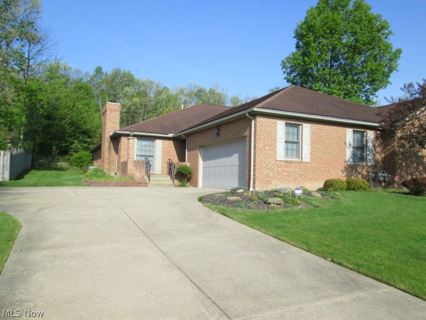 immediate possession!!  neutral décor..all appliances including washer & dryer stay!!  fireplace in living room...laundry room has sink & cabinetry...6 panel doors throughout & beveled countertop in kitchen...security system...home warranty...door from bedroom leads to back yard...Mahoning valley bike trail in back yard though you can't see it!!    This unit is one side of a duplex condo known as Cozy Nest...each unit takes care of their own "expense"...pet restriction:one dog weighing no more than 55 lbs or one cat no more than 15 lbs...pets not allowed to be tied outside nor roam free...dogs must be on leash and all droppings cleaned...if pet causes a nuisance or unreasonable disturbance will be removed from premises