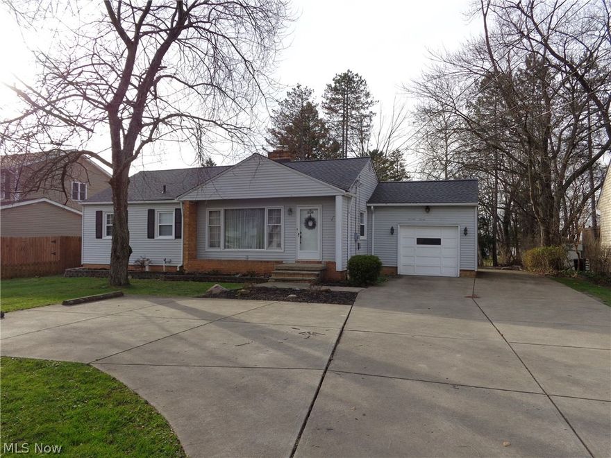 Very nice bright & airy home. Open kitchen & family rm looks out over the large deck & lot. Gray & white eat-in kitchen w/lots of storage cabinets. Wood burning fireplace in the living rm plus a wood stove in the family rm. 3 bedrms, 2 full updated baths. Roof was done 2013, furnace 2016, water heater 2020. 1-car attached garage w/breezeway plus a concrete drive (pad) to add more garages next to the one that is here. Nice large deck, private yard, turnaround drive, plus a pad for a shed. Basement workshop area & space to make a finished rec rm. Waterproofing & reinforcing of the basement was completed this Dec.