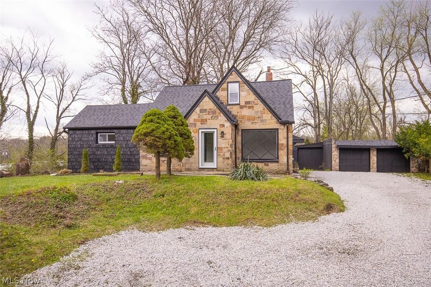 This fully renovated 3 bed 2 full bath is breath taking from the moment you step inside. Natural stone exterior with bold black and white design. The brand new kitchen features granite countertops, herringbone tile backsplash ,stainless appliances, and a center island. Both bathrooms are fully updated with custom tile work and matte black fixtures. The finished lower level adds bonus living space, and a brand new deck built in the back. Over an acre of land with a 4 car detached garage..