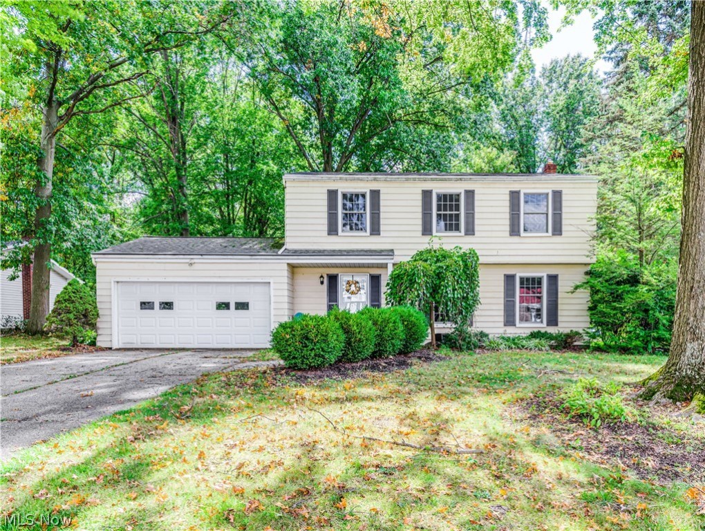 Welcome home to this impressive Colonial on a large private lot situated in desirable Crest Dale Estates. Light and bright with neutral decor throughout. This 5 bedroom, 3.5 bath home includes a first floor addition with a bedroom or office, full bath and an added family room with cathedral ceiling and tall windows filling the room with natural light. Foyer entry , formal living room and formal dining room with beautiful hardwood floors that continue through almost every room in the house. Beautiful updated kitchen with breakfast bar opens to the dining room and opens to another gathering area for family and friends. Four generous sized bedrooms and two full bathroom complete the second floor. All bathrooms nicely updated, new furnace in 2016 and newer windows throughout. Attached garage, patios and deck porch plus a full basement. Call to see today, you will not be disappointed!