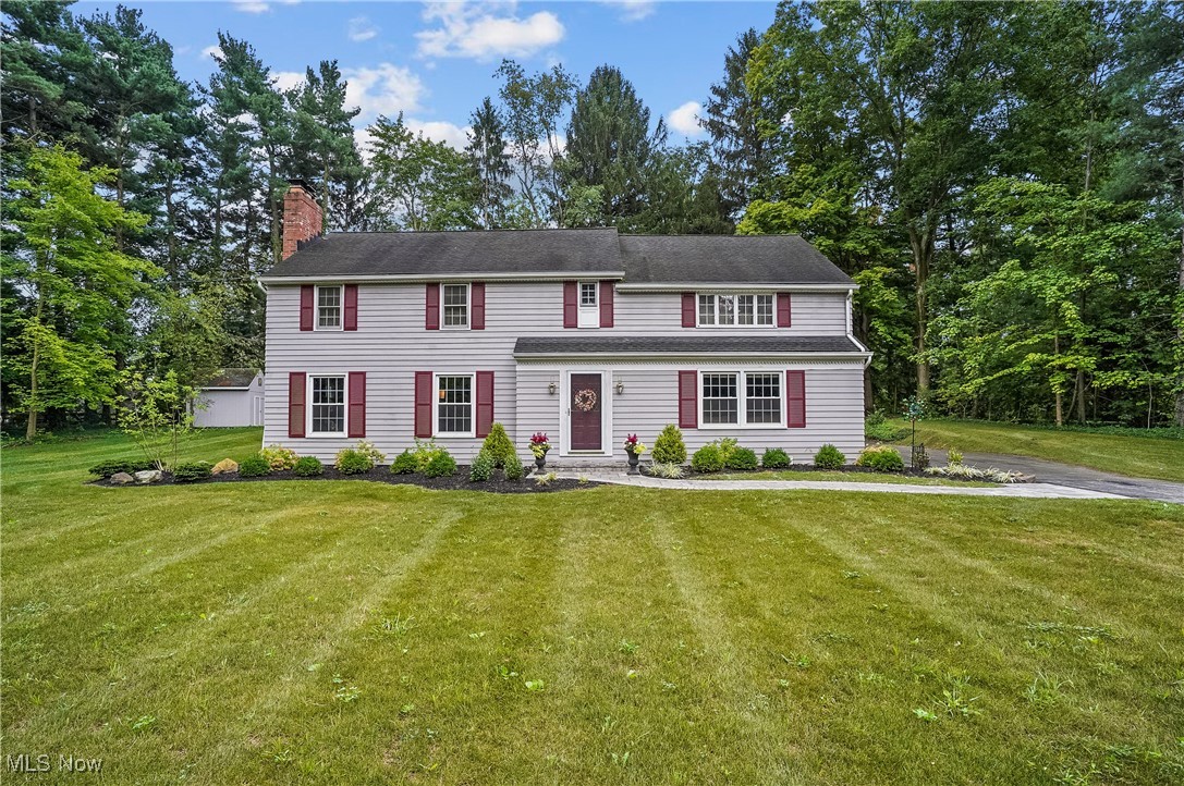 Gracious Colonial in a Serene Treed Neighborhood
Discover timeless elegance in this meticulously maintained, 4-bedroom, 2½-bath colonial nestled in a peaceful, tree-lined neighborhood A welcoming landscaped yard and front walk set the tone as you step inside to beautiful hardwood floors throughout, complemented by tasteful crown molding in the hall and living room with wood burning fireplace. The well-proportioned family room, complete with built ins, offers a comfortable retreat, while the formal dining room—adorned with a chair rail—opens via French doors onto an inviting screened porch with ceiling fan, perfect for relaxing evenings or morning coffee. The eat in kitchen flows effortlessly from the dining area and features ample counter space, ideal for a coffee bar or baking station. A convenient powder room just off the kitchen adds practicality to daily life. Hardwood stairs lead upstairs to four spacious bedrooms served by two full hall baths. One of the front bedrooms has an attached small room with a window – a flexible sunlit space that could serve as a home office, walk in closet or reading nook.The upper hallway is also enhanced with two built in linen closets, offering smart storage and organization. In addition to attached two car garage, a large storage shed is easily accessible in the backyard. The home has an added feature of walk out basement access to the backyard. The basement has a fireplace that has been capped and sump pump. All appliances including washer, dryer, basement freezer, all window coverings, wall mounted TV in family room, playset, EcoBee smart thermostat stay.