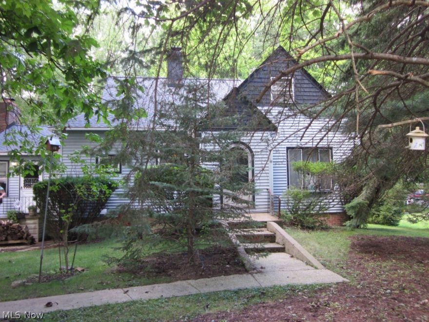 Set on an eclectic street with loads of privacy. This is an estate sale being sold "as is". Needs your finishing touches. Two car garage is a tandem that could hold four cars. Bring your ideas to turn this into a charmer. New roof with new gutter guards. Garage and some rooms are full, but will be removed by antique sale. Priced to sell.