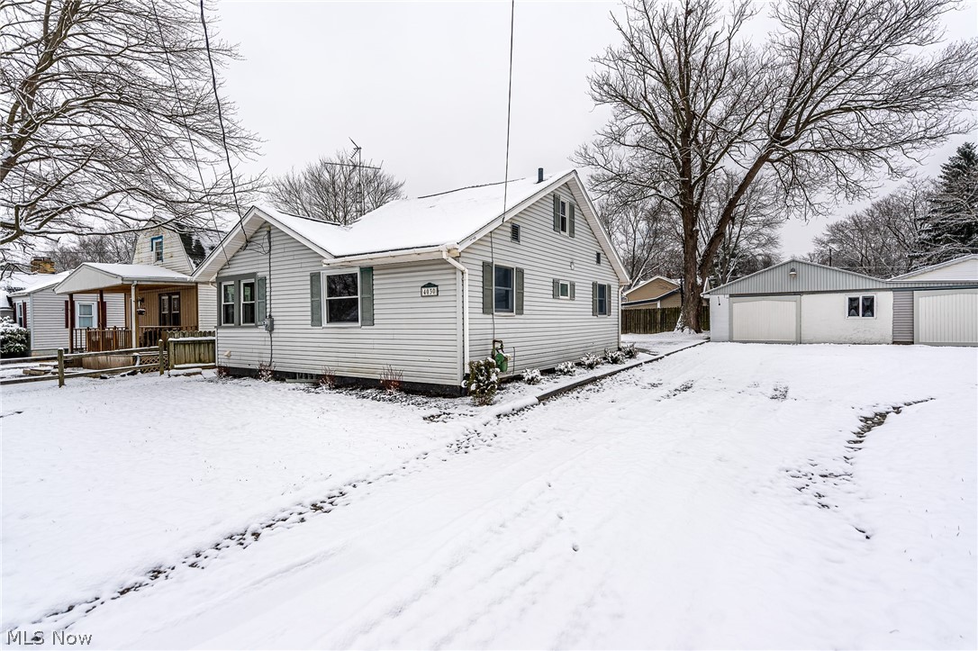 First floor living in Louisville! Car lover's dream. Updated home with main level bedrooms, and a main level laundry. Large family room. Outside has a newly poured concrete patio and partially fenced yard. The 24x48 garage has a perfect spot for a car lift. 22x32 workshop. Both outbuildings have their own electric.