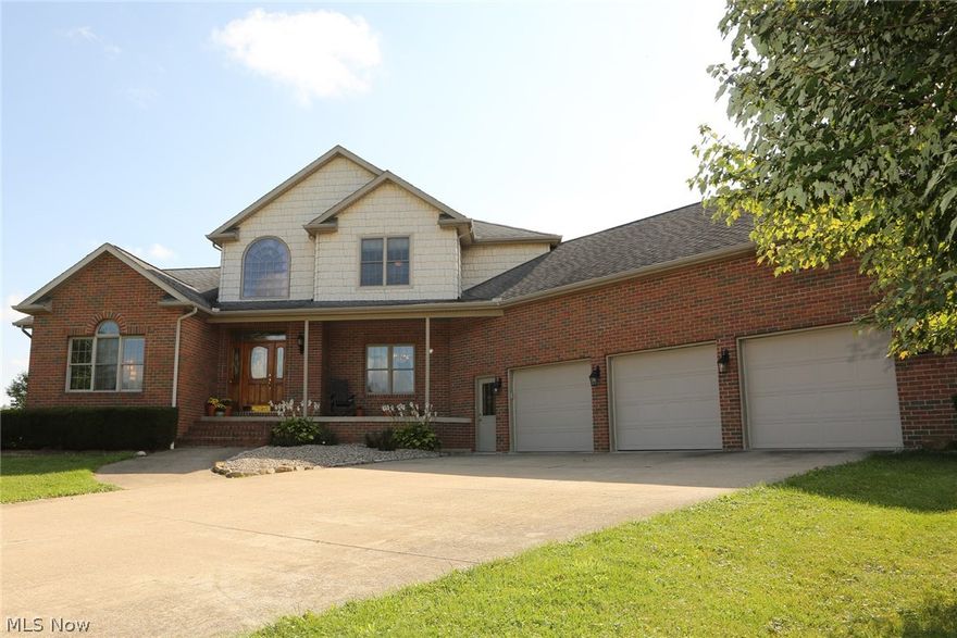 Wow what a beautiful custom home in deer trace, West Branch Schools District. 4 bedrooms, 4 bathrooms - 3 full, 1 half. Great first floor master bedroom with whirlpool tub and block glass shower. Nice open kitchen with hickory cabinets, quorum counter tops, breakfast bar, walk-in pantry and ceramic kitchen floors. The French doors take you to a peaceful sun room and stone patio. Elegant wood floors in the family room, hall, dining room with a great looking staircase. This home has a unique basement, the wood floors come from a school basketball gym (priceless). The home has had more then 10k in updates in less than a year - painting, lighting, reverse osmosis, water tank, jack-n-jill bathroom floor/update, softener valve/control,  septic release and many more to mention. Walking distance to Westville Golf Course. Out building is 24x32 with 8ft ceiling. Una casa bellisima.