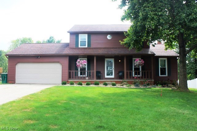 Picture perfect 3 bedroom, 2.5 bath colonial w/approx. 2028SF including walkout lower level & many updates* Starting with lovely curb appeal with new siding (2015), river rock landscaping (2014) & full covered front porch* Neutral décor* Living room/office* Formal dining room with crown molding, chair rail & newer track lighting (presently used as an office)* Great room with brick fireplace with newer gas insert (2013), mantle & bay window* Bayed kitchen with updated sink & counter tops (2014), Whirlpool appliances (refrig, 5 burner gas range & microwave- 2011) & pantry* Eating area with access to deck & updated atrium door with built in blinds (2012)* Main level 1/2 bath* Master bedroom with walk in closet & updated bath (2013)* Guest bath updated (2013)*Spacious walk out lower level rec room with updated atrium door with built in blinds (2012)* Composite deck (approx. 2005)* 10x12 storage building* 2 car attached garage with keyless entry & service door* Other updates include kitchen
