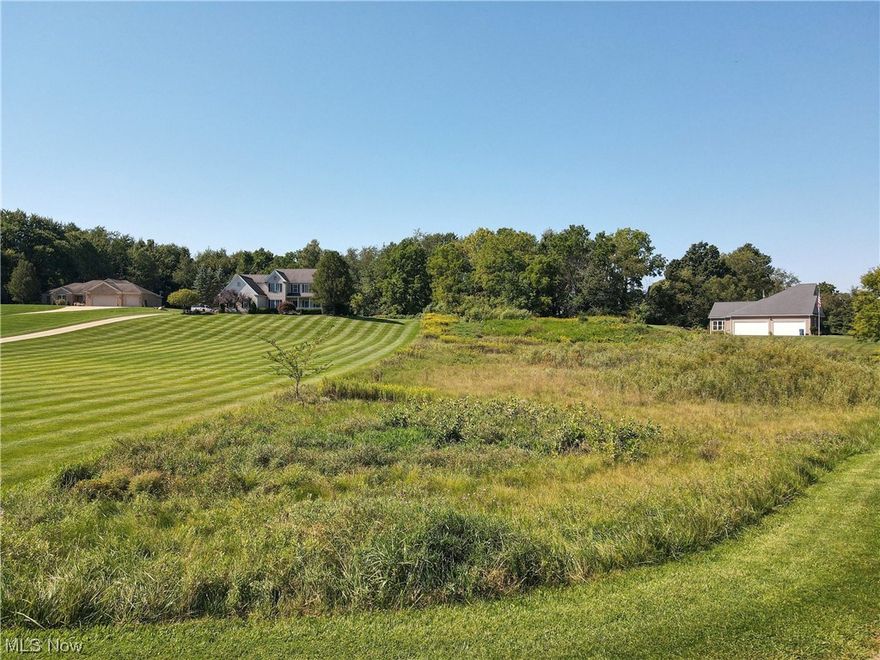 Vacant 1.605 acres lot at 354 Excel Ln in Whispering Meadows Estates. Bring your own builder to build your dream home on this gently sloping lot in Suffield Township/ Field Local Schools. Lot has soil testing was completed in 2017.