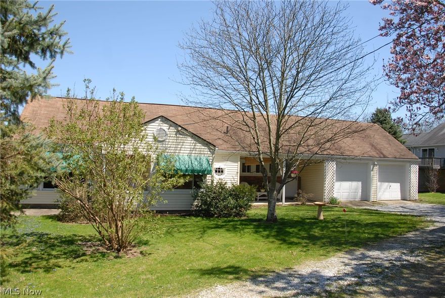 Charming ranch nestled on large street-to-street lot. Seller has remodeled over last ten years including stove, refrigerator, windows, awnings, ceiling fans, custom large slat blinds and more. 16x8 front porch with plenty of room for comfortable chairs. 20x11 covered back patio overlooks spacious yard (partially fenced). Second bedroom currently used as an office.  Roomy attic with 2 sets of access stairs, could easily be a third bedroom. Large attic fan recently installed. Nicely landscaped. Special tornado room beneath family room. Seller providing home warranty for your protection.