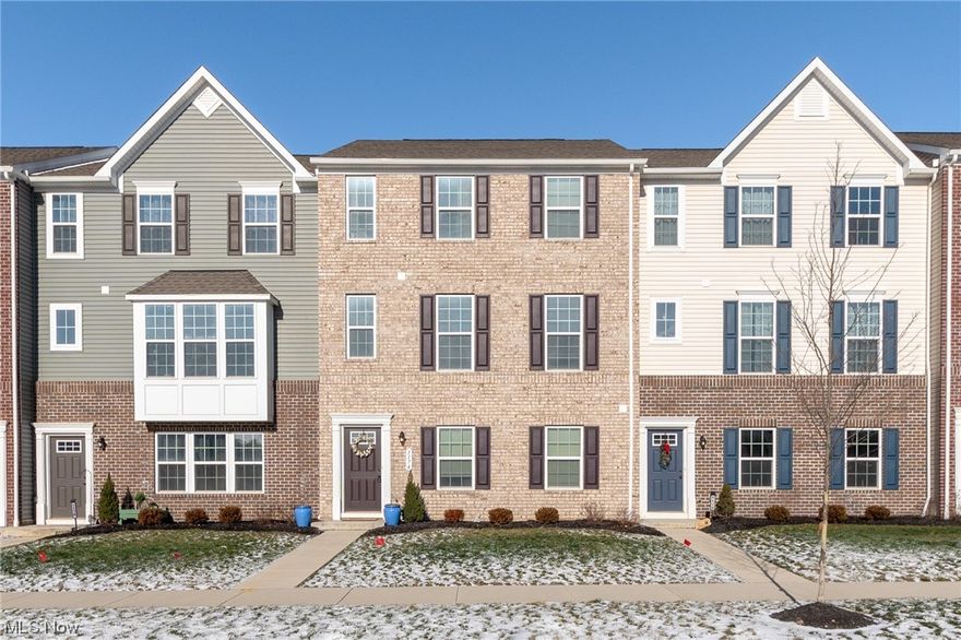 Indulge in the contemporary lifestyle at The Villages of Sycamore Lane with this almost new townhouse built in 2020, epitomizing Northampton's latest no-maintenance community designed for the on-the-go modern enthusiast! Save the money on building, this one is only three years old and has additional updates the new construction homes don't have! The main-level living area embraces an expansive concept, featuring a great room discreetly hosting a half-bath and coat closet. This space seamlessly opens to the deluxe kitchen and dining room combo, complete with a pantry, stainless steel appliances, and an expansive center island offering extra cabinetry with pull-outs, a bar counter, and ample culinary prep space. Ascend to the upper third level to discover the main bedroom suite with a walk-in closet, a full bath featuring a walk-in shower, and a double vanity. Two additional bedrooms, a second full bathroom, and a convenient laundry closet with full hookup complete this level. The lower, first floor boasts a secondary laundry area, a double-stall garage, a finished storage room turned into a living room or 4th bedroom, and a roughed-in bonus room ready for your personal touch. Plus, enjoy the convenience of a freshly painted and finished garage. Revel in maintenance-free living in this recently-built modern home, ideally located just minutes away from the scenic Cuyahoga Valley National Park. Reach out to your favorite Agent to see this one and don't miss the opportunity to make this your new​​‌​​​​‌​‌​​​‌‌​​​‌‌‌​​‌​​‌‌​​​​ #homesweethome!