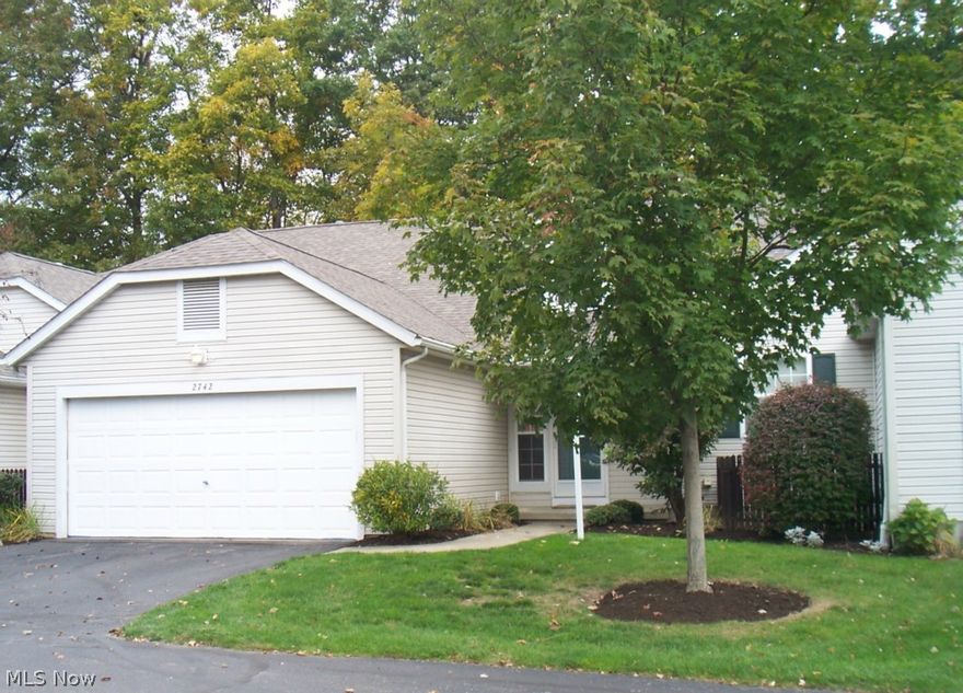 Welcome to this lovely condo in park-like, quiet setting. This home is very well-maintained with neutral décor thru-out. Included is a large great room/w formal dining area, a fully applianced kitchen w/breakfast bar, a 1st floor laundry, 2 bedrooms (one on 1st floor), a loft,  2 1/2 baths, and a partially finished basement. The interior boasts an open floor plan with large dual master suites on each floor - both with walk-in closets! The garage is a car or craft lover's dream with separate climate control, plenty of open shelving and cabinets. The basement is partially finished with carpet and drop ceilings. The location is central to Stow, Hudson and Kent shopping and conveniences, as well as the Bike & Hike Trail. There is public transportation within easy walking distance. Updates H20 and carpet (2013), roof, furnace and a/c (2012), tile and laminate flooring (2008), Stainless steel kitchen appliances, washer/dryer, and light fixtures, (2005). And, the gas fireplace has been update