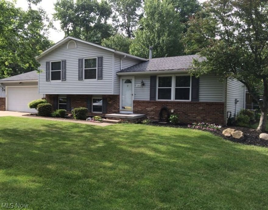 Upon entering this meticulous home you will be able to tell all the wonderful things the seller has done.  Crown moldings, New carpet, Granite countertops in kitchen, Updated baths with ceramic tile,  new lighting, finished room in the lower level, stamped concrete patio and lighted tiered deck, new front porch, new roof 2009, new windows 2011, new siding, gutters, and downspouts 2010, New interior and exterior doors, and so much more.  
Even the garage is heated and painted.  
This home is truly move in condition in a wonderful family neighborhood.  
If you are looking in this price range, be sure to call us or your agent.