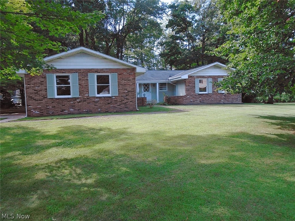 This 4 bedroom, 2 bath ranch sits on .59 partially wooded acres. Corner property backs to Kellogg Creek. Includes brand new stainless french door refrigerator, glass top range, and over-the-range microwave. All new, double pane, tilt-in, windows. Most rooms have original hardwood floors. There is new carpet in the family room and new grouted luxury vinyl floor tile in the foyer, kitchen, and laundry area. Unfinished basement under the foyer, living room, kitchen, dining room, and family room. Crawl space under the bedrooms and baths. Gas furnace with central air. Two car attached garage with concrete driveway. Exterior is brick and aluminum siding.