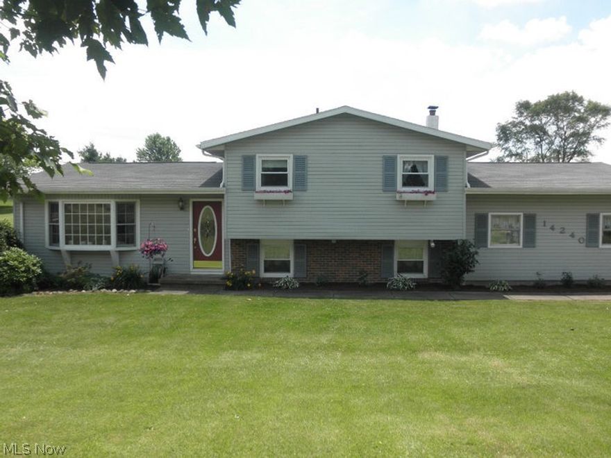 Sellers are relocating with their job and are motivated to sell! This lovely home is picture perfect inside and out!  So much updating has been done here!  You will fall in love with this home the moment you walk in.  Welcoming living room has a large bayed window and fireplace, there is a spacious dinette for everyday dining or larger gatherings, awesome remodeled kitchen has newer appliances.  The second floor features three spacious bedrooms and a remodeled full bath with tile floor and solid surface counter top.  The lower level features a 15 x 21 great room and a brand new full bath with a gorgeous tile shower plus a heated tile floor.  Gorgeous wood floors and solid wood doors throughout, new water softener and water heater.  This home is nestled in a private, 2.5 acre homesite with beautiful views from every window. Better yet, this home comes with a home warranty! Make this home a must see!