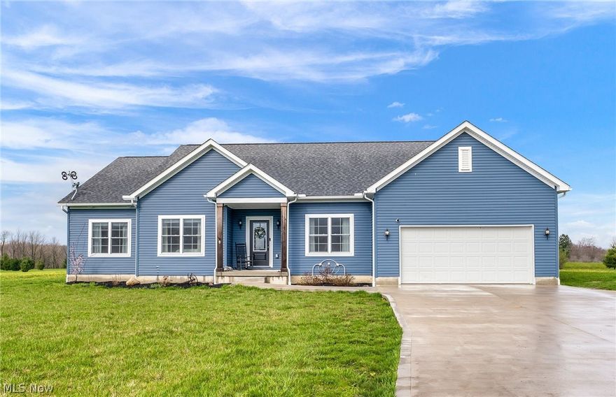 Nestled on nearly 4 acres of private land, this custom-built modern Craftsman style home offers the perfect blend of luxury and comfort. Boasting almost 3,000 sq ft of living space on the 1st floor, this newer home features a striking gable front entry and a custom decorative glass front door that welcomes you into an open concept layout filled with natural light from the many windows. The interior is adorned with neutral, bright paint colors and high-end finishes. The beautiful kitchen is a chef's dream with custom white wood cabinets, granite countertops, a subway tile backsplash, stainless steel appliances, and a spacious center island with storage. 9 ft ceilings throughout the whole house! The Great Room features a custom fireplace, LVP flooring, and modern light fixtures add to the elegance. The first floor also includes a laundry room, mudroom, and four bedrooms including a luxurious master suite with large walk-in closets and a spa-like bathroom featuring a soaking tub, glass shower, and granite countertops. Two additional full bathrooms on the 1st floor boast stone countertops. Step outside to enjoy the scenic views from the front porch overlooking a horse farm, or relax on the huge concrete patio with a covered area for outdoor entertaining. The fully landscaped yard with a long concrete driveway. 4 car garage! This efficient, all-electric home also offers a full, enormous basement with 2,752 sq ft of potential living space. Don't miss your chance to own this pristine property that combines modern luxury with serene country living.