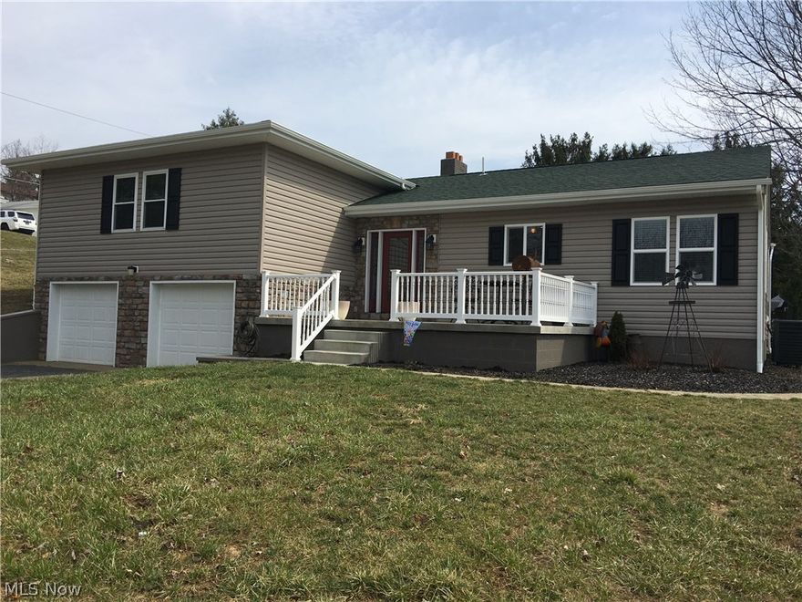 Completely remodeled from top to bottom finished 2/9/2015 . Open floor plan with large foyer. Everything NEW including roof, furnace, A/C,windows,hot water tank,carpet, wood floors, bathrooms, kitchen,electrical ,plumbing, insulation, windows and siding.  This is as close to a new construction as you can get without digging a hole! Beautiful wood flooring, very tastefully decorated in all neutral colors. Large covered concrete patio in back with a new shed. Great concrete front porch also. Country living but 10 min to Wheeling or St. Clairsville. MOVE IN READY! New carpet basement being installed by Lowe's  two weeks from listing date.