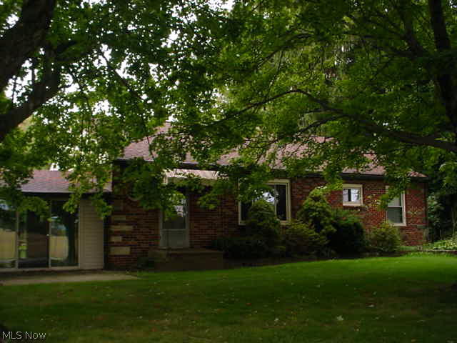 Brick ranch on large corner lot, dead end street! 3 bed, large living room, eat in kitchen w/wood flooring and family room w/wood burning stove and cathedral wood ceiling w/fan! 2 closets in master bed! Attached 2 car garage, full basement, rear patio and storage shed! New well 2006, roof 2008 and replacement windows! Just down from the new Springfield High School!