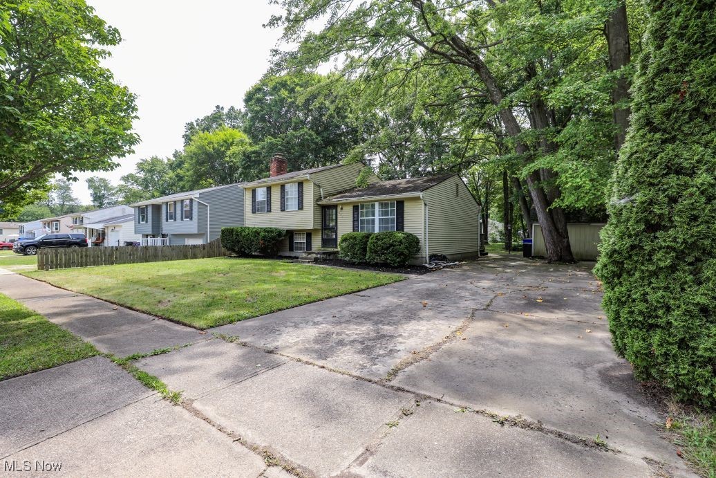 This cute home located at 675 Midway Drive in Ravenna features 1,286 sq. ft. Of living area with 3 nice sized bedrooms, 1 full bathroom, living room, an eat-in kitchen with access to the deck and back yard, and a spacious family room with wood burning fireplace in the lower level. Additionally, there is a utility room in the lower level that walks out to the back yard, ample storage under the home, a garden shed, deck, and a nice backyard. This home could use some TLC, but has great bones! At this price you can make this home the way you want it. Schedule your showing today!