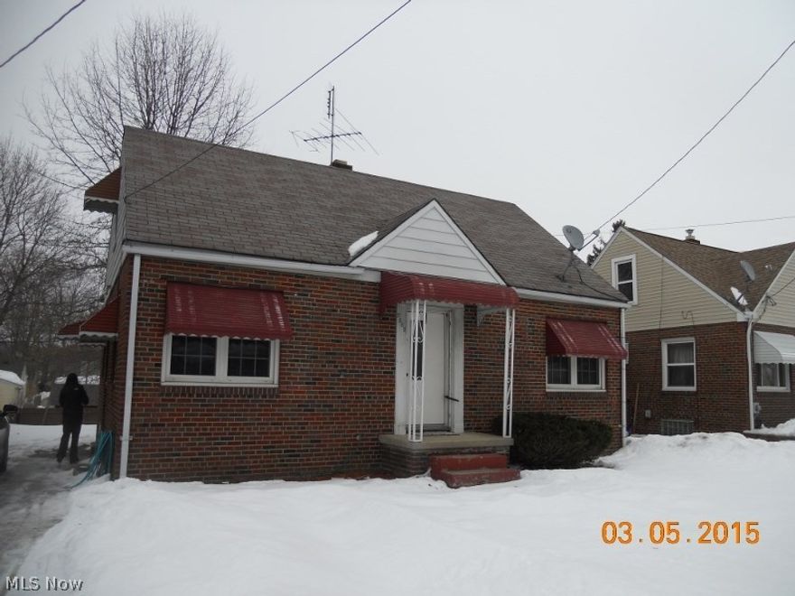 Brick bungalow w/ det 1 car garage. Needs TLC but great potential for the right buyer.