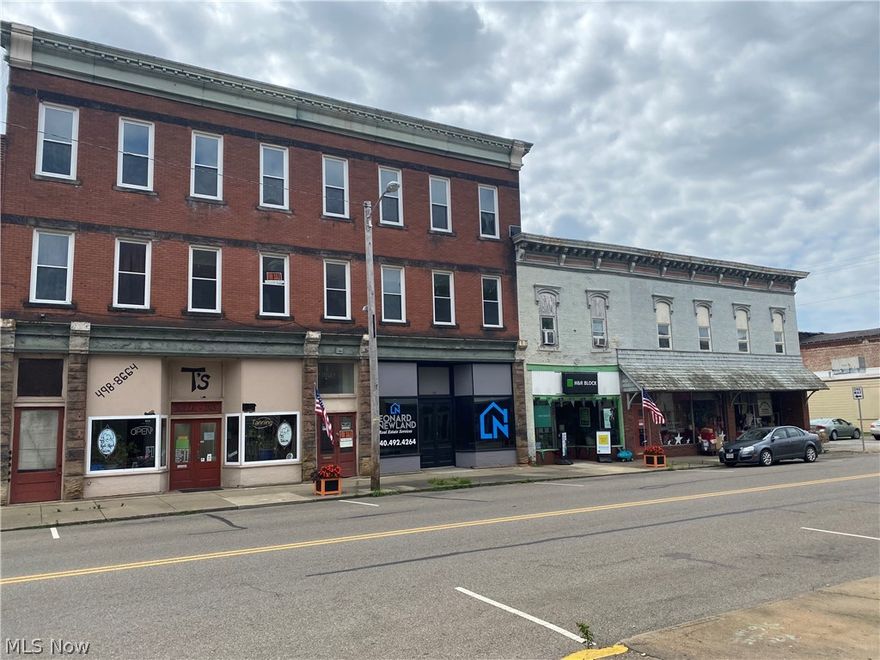 Large multi use commercial building. Lots of potential.