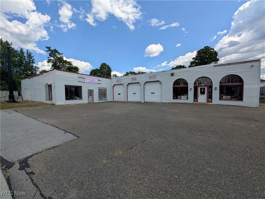 Prime Commercial Building Opportunity in a high-traffic location just off of RT 22-40 and minutes from the I-70/I-77 interchange. This property is very visible and is easily accessible.   Located near other local businesses including grocery, restaurants, gas stations, retail and the salvation army building.  This .96 acre location is ideal for a variety of commercial uses, warehouse, automotive, detail shop, mechanic shop, manufacturing, etc. Bring your vision as this property has so much potential and the possibilities are endless.  You can use the building as it is or build something new. The building consists of multiple sections.  You have a front open retail or office area approximately 33.8x28ft.  The middle section is approximately 24.2x34.6ft and has 2 bays with 2 12-foot doors. Next to that is a single bay area, 11.2x34.6ft with a 12-foot door.  The back warehouse area has a ground level section approximately 34.10x26.9ft with a 12-foot door.  The last section is approximately 24x34.10ft and has a raised loading dock with 8-foot door. To complete this property is a partially fenced gravel lot.  This lot has plenty of space and gives you many possibilities for a business.  Schedule your showing today to see if this is the building you have been waiting for.