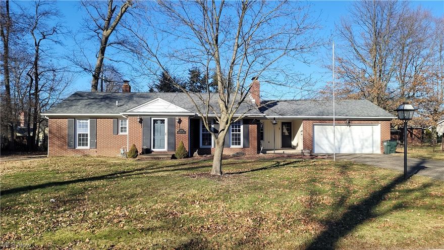 Welcome home to this darling 3 bedroom brick ranch home with hard wood flooring, newer laminate and built-in shelving around the living room fireplace and in the dining room.  2 fireplaces, finished basement and so much more! Enjoy morning coffee on you covered front patio or evening cookouts under the covered back patio! Spacious yard with large shed! Roof approximately 8-10 years old. Newer windows too! Close to shopping, dining & Mount Union College! Schedule your showing today!