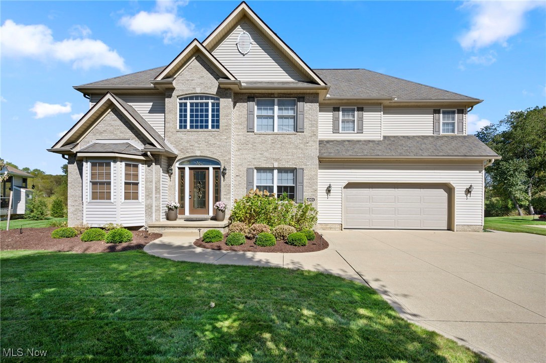 If you are looking for a home the blends comfort, luxury, and access to an active lifestyle-this custom built gem in Pebblehurst has it all!! Steps from the Metro Parks bike and hiking trails, it's perfect for outdoor enthusiasts! Nearby Fox Den Golf Course/Silver Springs Park..so much to enjoy! Relax on the stamped concrete patio year-round while soaking in breathtaking sunrises and views, or entertain guests in style. Inside, the 2-story foyer opens to a wonderful music/office area, formal dining with tray ceiling, and two-story great room filled with windows and anchored by a dramatic stone fireplace. The open kitchen features a breakfast bar spacious dinette area, and continued new (2022) flooring, first floor laundry and 1/2 bath. Upper level offers a primary bedroom/bath retreat with oversized walk in closet, luxurious glamour bath with corner garden tub, dual vanities, updated lighting and fixtures, water closet and walk in tiled shower. Three additional bedrooms and updated guest bath provide plenty of space for family and guests. The lower level is exceptional-offering approx. 800 square feet of finished living space complete with family room, full bath, office, built-in sink, and newer wine closet! Outside, enjoy the irrigation system that keeps your lawn lush and green all summer long and newer garage door (2022)...Don't miss the opportunity to own a home that offers both everyday comfort and a truly active lifestyle!