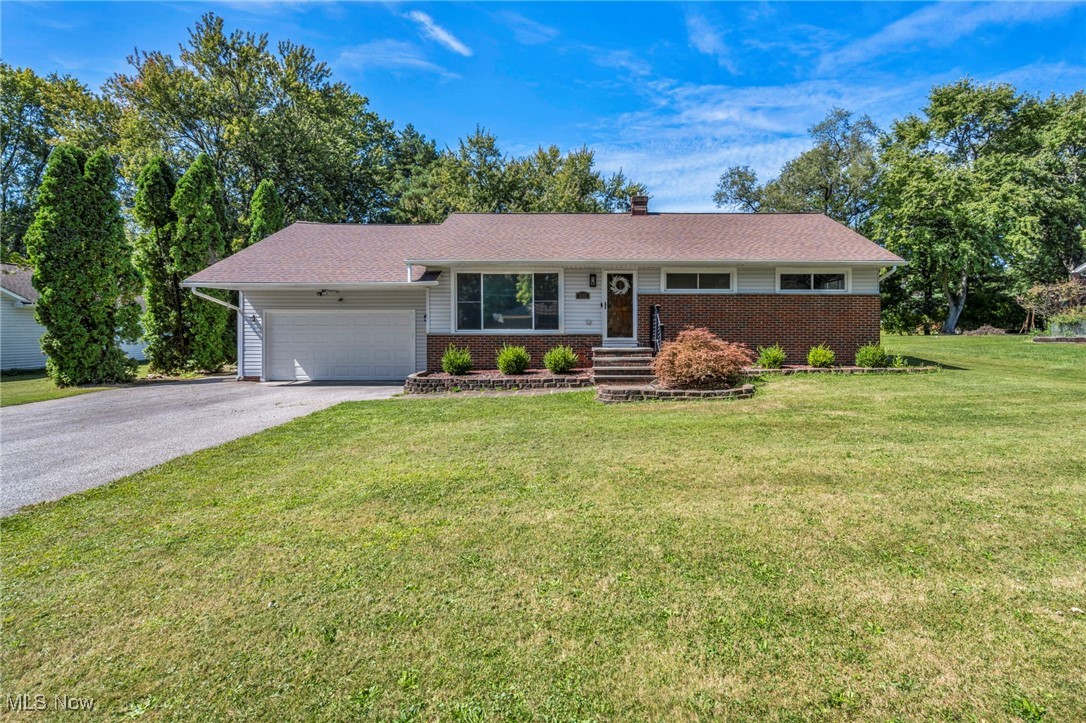 Set on a generous half-acre lot, this updated 4-bedroom ranch blends comfort, style, and functionality. Step inside to discover an inviting floor plan starting with a bright living room enhanced by refinished hardwood floors and fresh baseboards. The heart of the home is the kitchen, featuring stainless steel appliances, a dishwasher and convection oven, a new sink and faucet, abundant counter space, and plenty of room for a large table—perfect for everyday meals or gatherings. Three bedrooms and a beautifully updated full bath are conveniently located on the main level, while the fourth bedroom has been completely transformed with new stairs, carpet, paint, and closet door. The lower level expands your living space with a finished recreation room, bonus room, laundry area with washer and dryer included, and multiple storage options. This home has seen extensive updates throughout: roof replaced in 2023, new gutters and garage door in 2020, newer windows, updated drywall in both the basement and upstairs bedroom, new trim and lighting fixtures throughout, a newer hot water tank, and electrical improvements. The furnace and air conditioner were replaced in 2012, ensuring year-round comfort. Outside, enjoy an enclosed covered patio with a new roof, an additional deck ready for your finishing touch, an extra-wide driveway, and a heated garage. With its long list of upgrades and move-in-ready condition, this home is ready to welcome its next owner—schedule your private showing today!