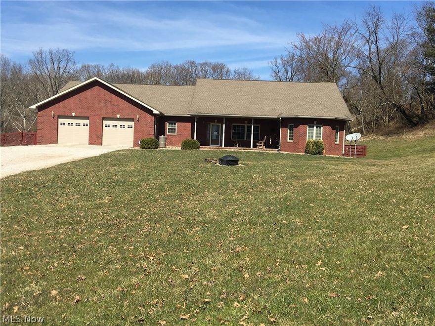 Immaculate brick four bedroom, three bath home with total one-floor living situated on five acres.  Beautiful large open rooms with 6-panel solid Oak doors and trim.  Lovely open kitchen with stainless appliances.  2611 sq ft unfinished walk-out basement with radiant heat floors.