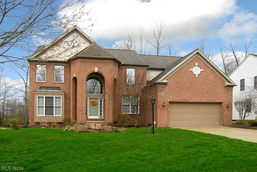 Truly a move in ready property in the highly desirable "Ledges" development. This colonial boasts a two story foyer with a double staircase. The staircase opens to the formal living room and a formal dining room. This open floor plan features a two story great room with a fireplace, a wall of windows and leads into the spacious kitchen with a center island, wood flooring, appliances and an eating area that includes sliding doors to the custom deck and backyard. There is a newly remodeled first floor office (den) with French doors and a built in cabinet, a half bath and first floor laundry room (newly remodeled) going to the oversized two car garage. The master suite contains two walk in closets, double sinks. a spa bath, and a separate shower. The three bedrooms upstairs have bath access and high ceilings. The lower level is a great retreat. It includes garden windows, a rec room, a tv room with built ins, a half bath, and a separate storage area. Appliances stay. Newly landscaped in 2