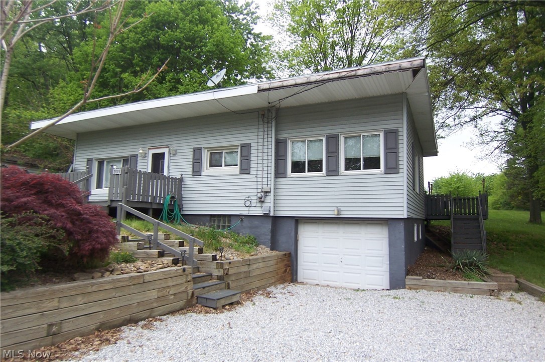 Great potential! Deep private backyard, almost acre! 2 bed with 3rd bed in lower level! Living room with woodburning fireplace and large family room that opens to large rear deck! Selling as is. No FHA, VA. Seller has never lived in property, was rental. Garage under family room, 2nd full bath in basement. Basement was waterproofed prior to seller owning, no paperwork. Hardwood floors under some flooring.