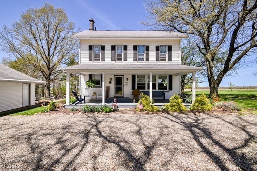 Welcome to this charming, move-in ready country farmhouse on 2.84 acres in Nimishillen Township and the desirable Louisville City School District. Enjoy peace and privacy in a kid-friendly backyard while you plant your garden, grow herbs in raised beds and harvest grapes, pears, berries, and apples. This house has original architectural features with modern updates. All neutral colors will fit any decorating style. There is more storage than most homes of this age and style. Step into the foyer and a beautiful spacious living room with 9 foot ceilings. Continue into the large dining room/ the centerpiece of the house with a woodburner and built-in shelving. The kitchen has ample storage with a newer refrigerator and a self-cleaning oven. A large pantry is off the kitchen for even more storage. There is also a room on the first floor currently used as a library but would have many uses with extra storage.  The updated bathroom is on the first floor with a tub-shower combination and custom-made wood features to enhance its beauty. On the second floor, there are 3 large bedrooms with multiple windows and a half bathroom. The master bedroom has two large closets. There is also a walk-up attic for even more storage. There is a three car garage with two parking spaces and a separate room that could have multiple purposes.