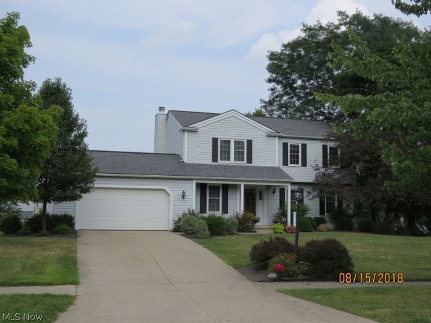 Welcoming colonial in North Royalton.  Gorgeous yard, rear deck, above ground pool.  Granite counters, with tile backsplash, vinyl windows, crown molding in LR and DR.  4 bedrooms, open kitchen, family room w/fireplace, finished lower level.  Make it home today!