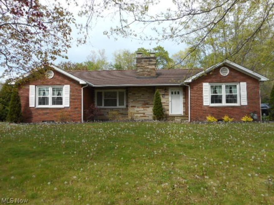 Solid brick and stone ranch in the heart of Painesville Twp close to schools, shopping and freeways, yet sitting on a very private .70 acre parcel. Split floor plan offers first floor laundry addition with vaulted ceiling, kitchen with many cabinets, updated counter with breakfast bar seating, deep sink and ceramic flooring. There’s a slider walkout to rear yard and very private patio.  Enter from the foyer into a spacious living room with wood burning FP and lots of natural light. All windows have been replaced by current owner and provide for easy cleaning. Some updating to the baths could be done but home is spacious, clean and well maintained. The basement is clean and has walk out to rear yard from a huge workshop area.  There are hardwood floors throughout in meticulous condition and carpeting in living room could be removed. Basement does have one finished room which could be a bedroom or office. There’s a whole house fan, efficient hot water baseboard heat in the main home with