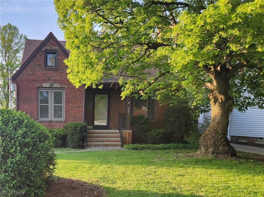 Come see this true four-bedroom brick bungalow! The large eat-in kitchen is charming, with white cupboards and lots of natural light.  Make the living room your own, and enjoy the cozy fireplace and large picture window. This four-bedroom home has two bedrooms on the first floor and two bedrooms on the second.  Each floor has its own full bath!  And, there's a bonus room upstairs! Freshly-painted with neutral colors throughout.   Replacement windows and new hot water tank.  Central A/C.   Located in the desirable Parma Circle area, near schools, shopping, restaurants, and transportation. All appliances stay!  Book your showing today!