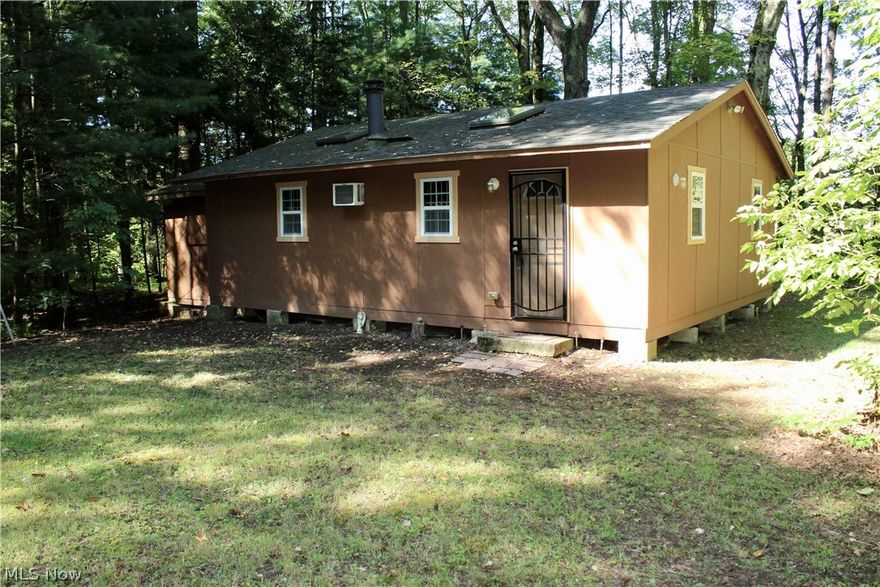 Campers delight! This 10+ acre property in Cherry Valley Twp is a true hidden gem. Great for hunters, campers or just anyone who wants to get away from the hustle and bustle of life. The cabin is sectioned off into 5 different rooms including a living room, 2 bedrooms, a kitchen and a bathroom with a composting toilet. There is a complete electrical system here so you don't have to completely disconnect. A wood burning stove and a wall unit air conditioner will help to keep you cozy, no matter the time of year.